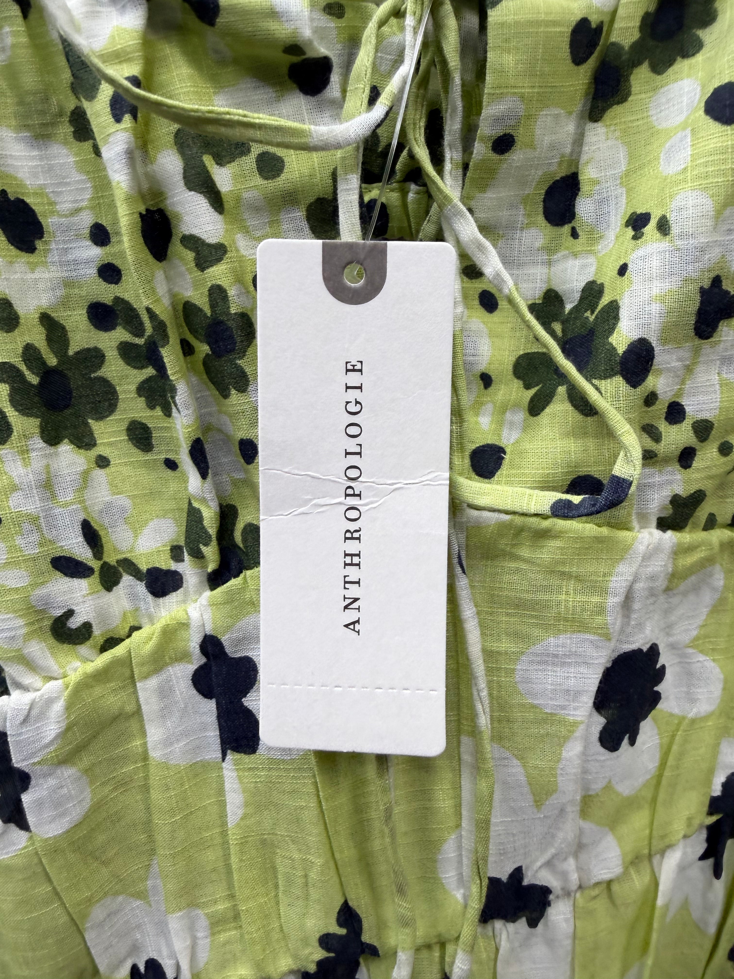 Green floral tiered mini dress by Diverse Finds, featuring a flowy design and vibrant floral pattern, size medium.